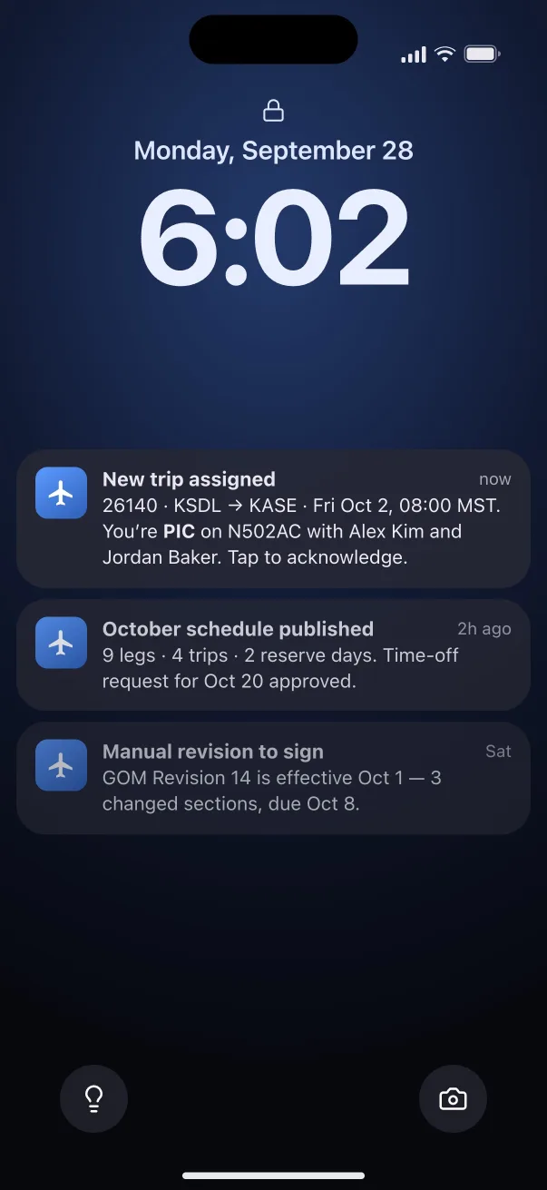 The lock screen with notifications: a new trip assigned, the October schedule published and a manual revision to sign.